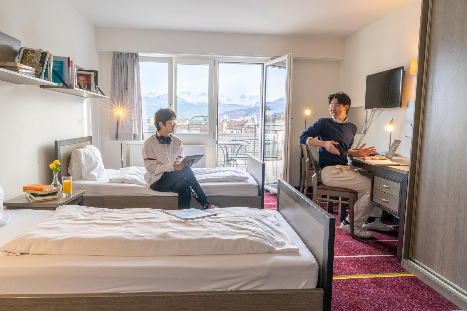 Shared student room in a BHMS campus apartment