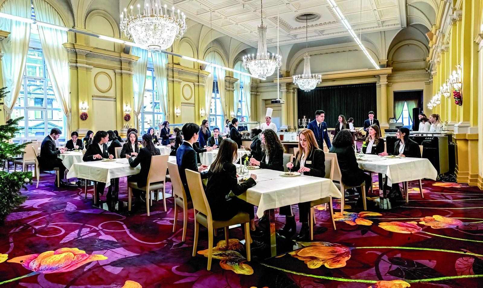 Students dining together in the BHMS City Campus Restaurant