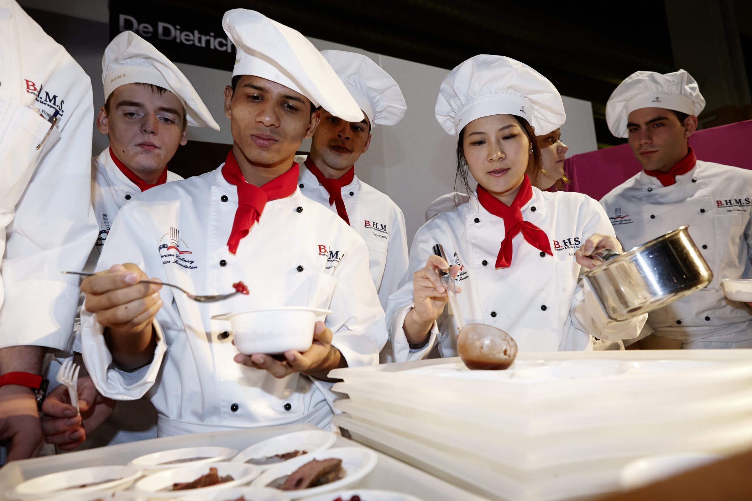 BHMS students presenting chocolate creations at a Salon du Chocolat event
