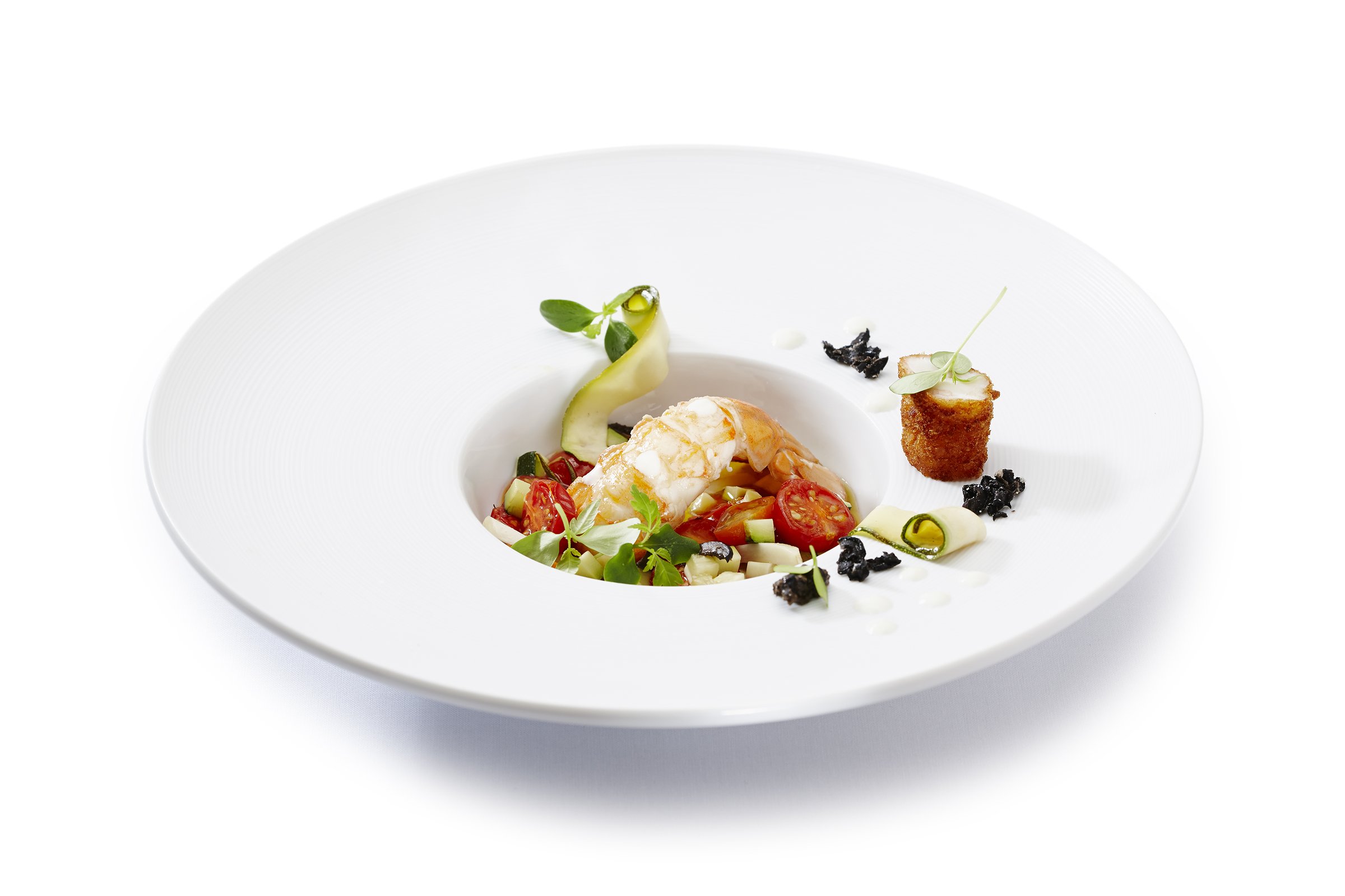 Studio-lit lobster dish plated at the Swiss Culinary Academy by BHMS